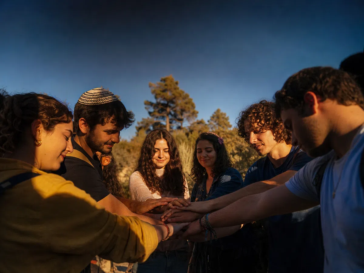 Young people gathered together at a YMJA retreat